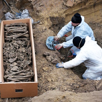 The remains of Soviet and Italian soldiers are uncovered. Photo: AFP
