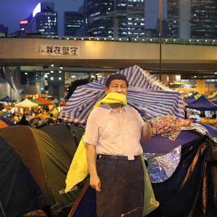 A life-sized cut-out of President Xi Jinping is seen in the Admiralty protest site. Photo: EPA