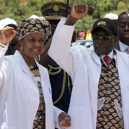 Zimbabwe President Robert Mugabe (right) with his wife, Grace, who has been elected to a top post as head of the ruling Zanu-PF party's women's wing. Photo: Reuters