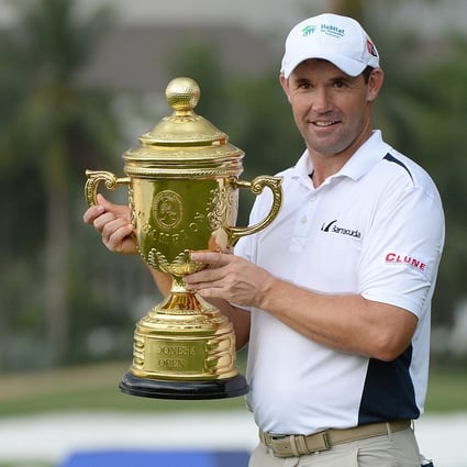 Padraig Harrington of Ireland with his trophy after winning the Bank BRI Indonesia Open in Jakarta. Photo: AFP