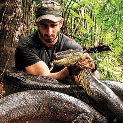 A photo provided by The Discovery Channel shows Paul Rosolie with the huge anaconda which later failed to swallow him whole. Photo: Handout 