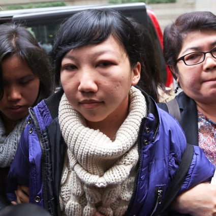 Erwiana Sulistyaningsih, an Indonesian domestic worker who accuses her Hong Kong employer of subjecting her to six months of physical abuse, arrives at the District Court in Wan Chai on Monday. Photo: Sam Tsang