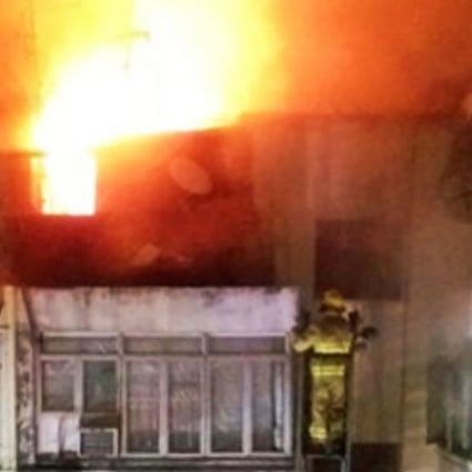 Police suspect a fire that broke out in a block of flats in Sham Shui Po on Sunday night was a case of arson. Photo: SCMP Pictures