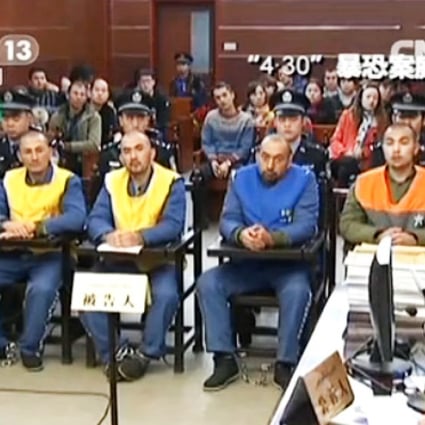 State television broadcast defendants listen to verdict. Photo: Screenshot via CCTV