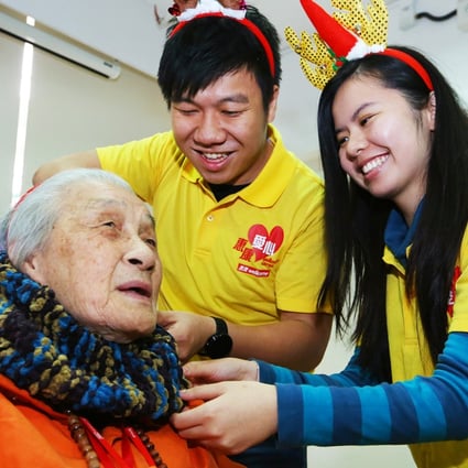 Law and Shum give a scarf to Lai Fung-sin. Photo: Edmond So