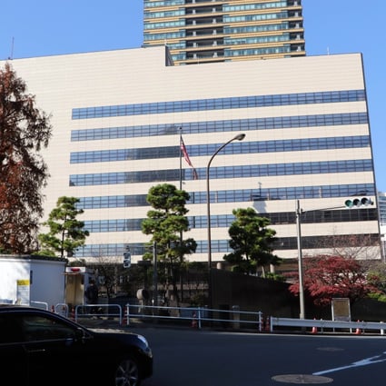 A police officer stands guard outside of the US embassy in Tokyo. American embassies went on heightened alert amid fears of a backlash after the release of he report. Photo: AFP