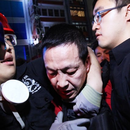 Ma Hei-yuk, 45, is subdued by protesters at the Mong Kok site on October 22. Photo: Dickson Lee