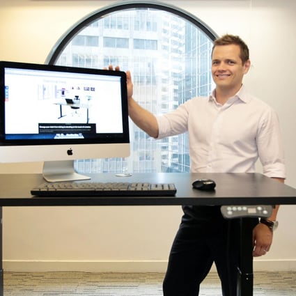 Physiotherapist and businessman Chris Sherer with his stand-up desk.Photo: Bruce Yan
