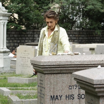 Judy Green places stones of remembrance on Lawrence and Horace Kadoorie's sarcophagi at the Jewish Cemetery in Happy Valley. Photos: Dickson Lee; The Hong Kong Heritage Project; Nora Tam