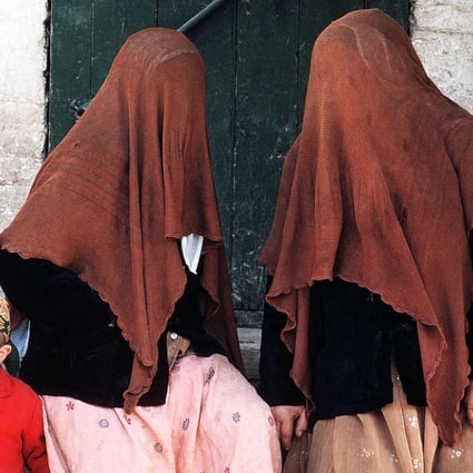 Uygur women wearing full face veils in Xinjiang, where the practice is becoming more commonplace. Photo: Imaginechina