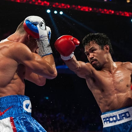 Manny Pacquiao takes apart previously unbeaten Chris Algieri in their World Boxing Organisation welterweight title bout in Macau on November 23. Photo: AFP