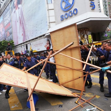 Police have started clearing the camp in front of the Sogo shopping mall. Photo: Sam Tsang