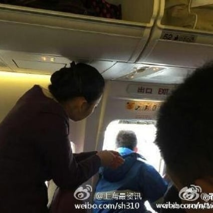 The first-time traveller opened the plane's emergency exit door to get some fresh air. Photo: SCMP Pictures