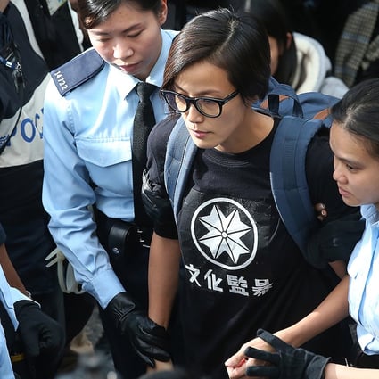 Police officers take away singer and actress Denise Ho Wan-see while police removed barricades and tear down tents at the Occupy protest site in Admiralty. Photo: K. Y. Cheng
