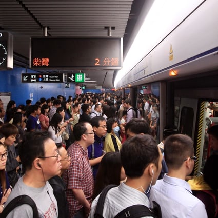 Some MTR commuters had to wait five minutes to enter stations this morning. Photo: Jonathan Wong
