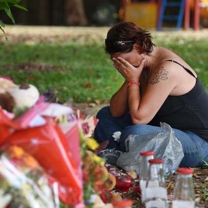 Resident Sam O'Grady mourns the eight children after the mother of almost all of the youngsters was arrested on suspicion of murder. Photo: EPA
