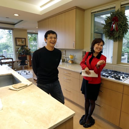Janie Lee shows a property to her client Wei Hongbin. Photo: AP