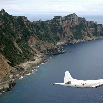 A Japanese surveillance aircraft flies over the disputed Diaoyu Islands. Photo: AP