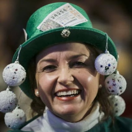 A woman appears full of hope as she attends the Christmas Lottery 'El Gordo' draw at the Royal Theatre in Madrid. Photo: EPA 
