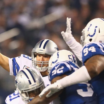 Tony Romo launches a pass. Photo: AFP