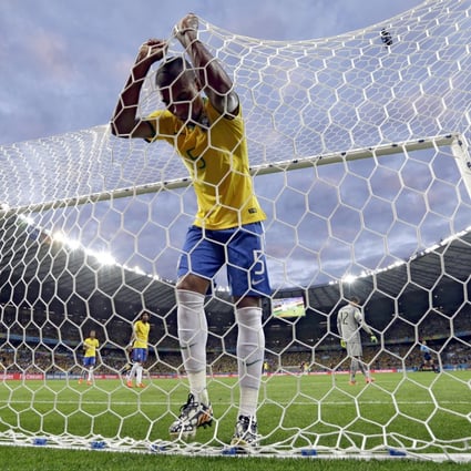 Brazil's Fernandinho is an inconsolable figure after Germany's Toni Kroos scores his team's third goal during their World Cup semi-finals in Belo Horizonte, Brazil. Photo: AP