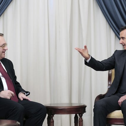 Syrian President Bashar Assad, right, speaks with Russia's deputy Foreign Minister Mikhail Bogdanov in Damascus, Syria earlier this month. Photo: AP