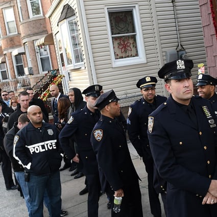 Officers line up for the wake for NYPD officer Rafael Ramos on Friday. Photo: AFP