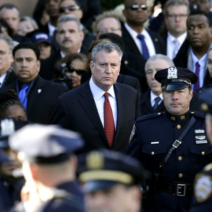 New York City Mayor Bill de Blasio (centre) leaves the funeral of New York Police Officer Rafael Ramos at the Christ Tabernacle Church in New York. Photo: EPA