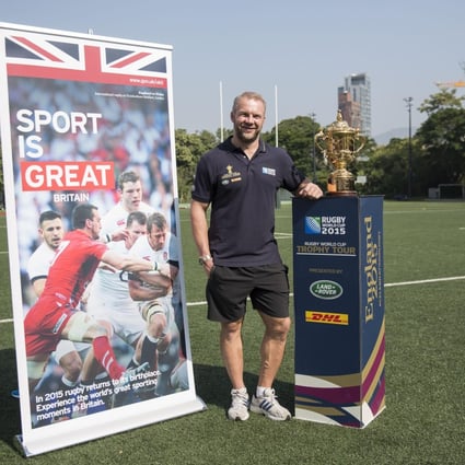 Former England sevens captain Ollie Phillips with the Webb Ellis Cup during a 2015 Rugby World Cup promotional event in Hong Kong. Photo: SCMP Picture