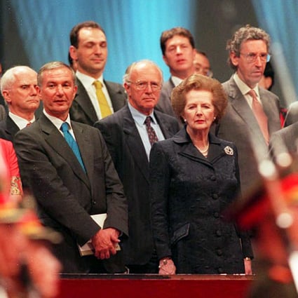 Former British prime minister Margaret Thatcher and husband Dennis (right) during the handover in 1997. Photo: AFP