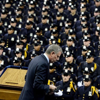 New York Mayor Bill de Blasio addresses the police academy's graduating class in the aftermath of two officers' murders. Photo: EPA