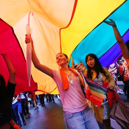 Participants hold giant rainbow flags during Hong Kong Pride Parade in Causeway Bay. Photo: Sam Tsang