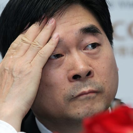 Future Holdings chairman Wang Zhenhua wipes his forehead as his company plans to develop 40 commercial properties over the next three years. Photo: Edward Wong