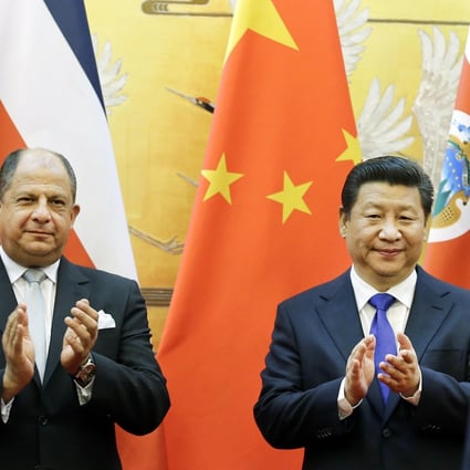 Costa Rica's President Luis Guillermo Solis pictured with Xi Jinping at the Great Hall of the People during his trip to Beijing. Photo: EPA