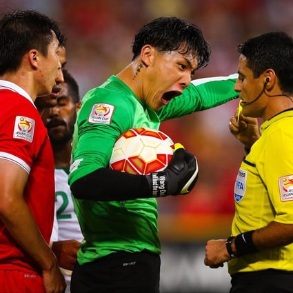China's Wang Dalei shouts at referee Alireza Faghani in their match against Saudi Arabia. Photo: AFP
