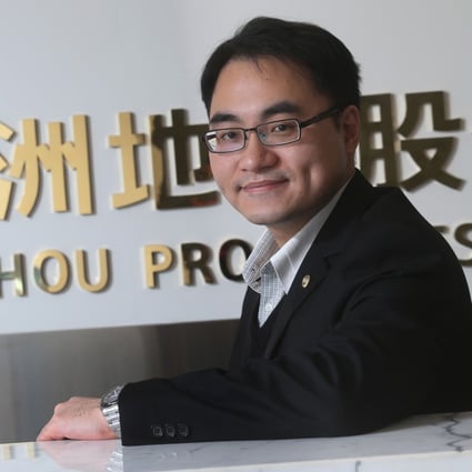 Yuzhou Properties chief financial officer Chiu Yu-Kang poses after an interview in his office, saying he is not in a hurry to grow the company. Photo: David Wong