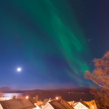 The Norwegian sky lit up by the Northern Lights and full moon. Photos: Corbis; Chris Graham; Truls Tiller