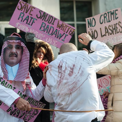 Protesters simulate the flogging in front of the US Saudi embassy in Washington on Thursday. Photo: AFP