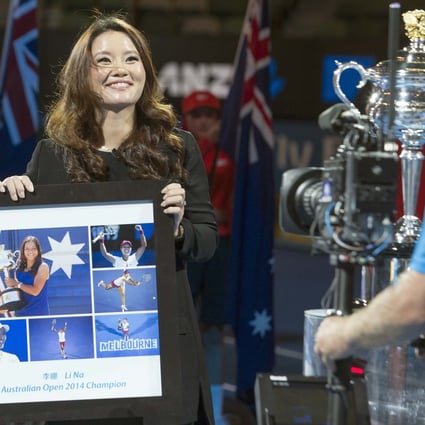 Current Australian Open tennis champion Li Na was presented with a gift during the official ceremony on Rod Laver Arena. It was then that she announced she was expecting her first child with her husband and former coach Jiang Shan. Photo: Reuters