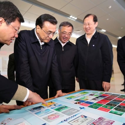 Premier Li Keqiang (2nd left) visits Nansha New Area of Guangdong Free Trade Zone in Guangzhou. Photo: Xinhua