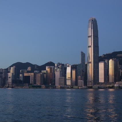 Hong Kong's skyscrapers gleam at sunrise as the government needs to take steps to develop commercial office space. Photo: Bloomberg