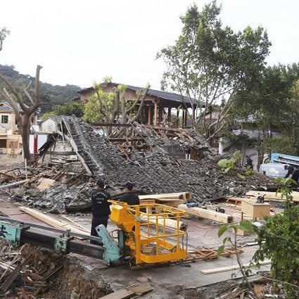 Police inspect the demolished film set after a construction worker was killed when scaffolding around a building being demolished suddenly collapsed. Photo: AP 