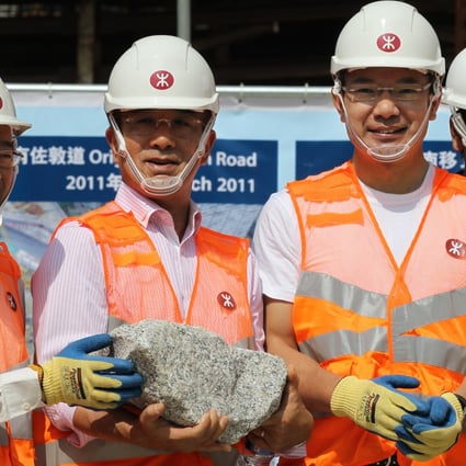 Lawmakers Chan Kam-lam, Michael Tien Puk-sun, Paul Tse Wai-chun and  Tang Ka-piu pose for a photo at the construction site of West Kowloon Terminus last April