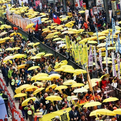 Thousands of pro-democracy campaigners unfurled yellow umbrellas for yesterday's march - but many stayed away. Photo: Felix Wong
