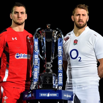 Wales captain Sam Warburton (left) and England skipper Chris Robshaw with the new Six Nations trophy. Photo: AFP