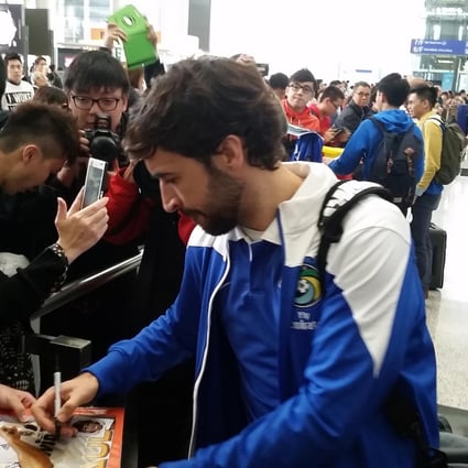 New York Cosmos star Raul is mobbed by fans on the team's arrival. Photo: SCMP Pictures