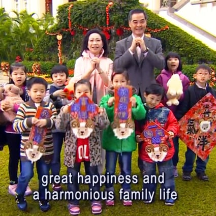 CY Leung and his wife pose with children in the Year of the Sheep greeting. Photo: Hong Kong Government