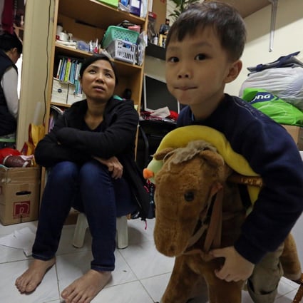 Chen Yiping with her three-year-old son Leung Pui-hei. Her husband, who works as a waiter, didn't want to show his face. Photo: Nora Tam