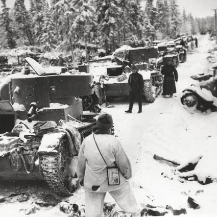 Finnish troops inspect destroyed Soviet vehicles in Finland, on January 17, 1940, during the winter war. Photos: US Library of Congress; Daniel Allen