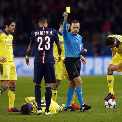 Referee Cuneyt Ckir finally tires of the treatment meted out to Eden Hazard and books Marco Verratti of Paris Saint-Germain during last week's Champions League tie. Photo: EPA